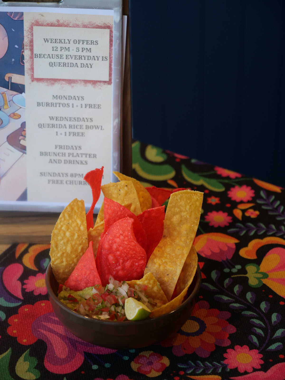 Colorful bowl of tortilla chips and Guacamole with Querida Offer , in AL Barsha